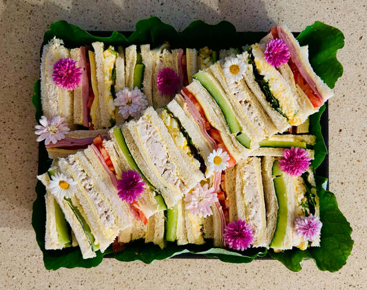 Gourmet finger sandwich platter with edible flowers